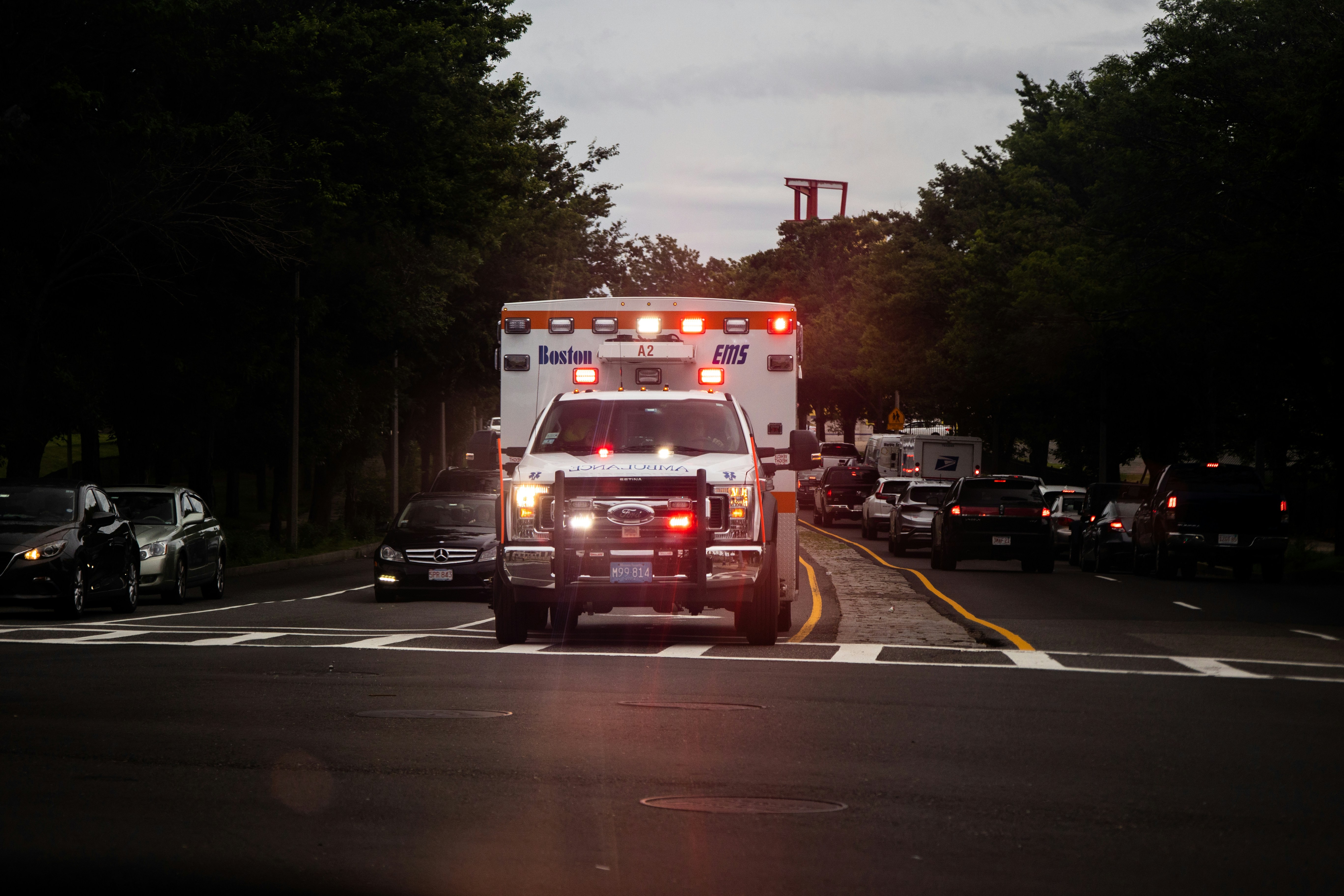 EMS ambulance on road with lights active