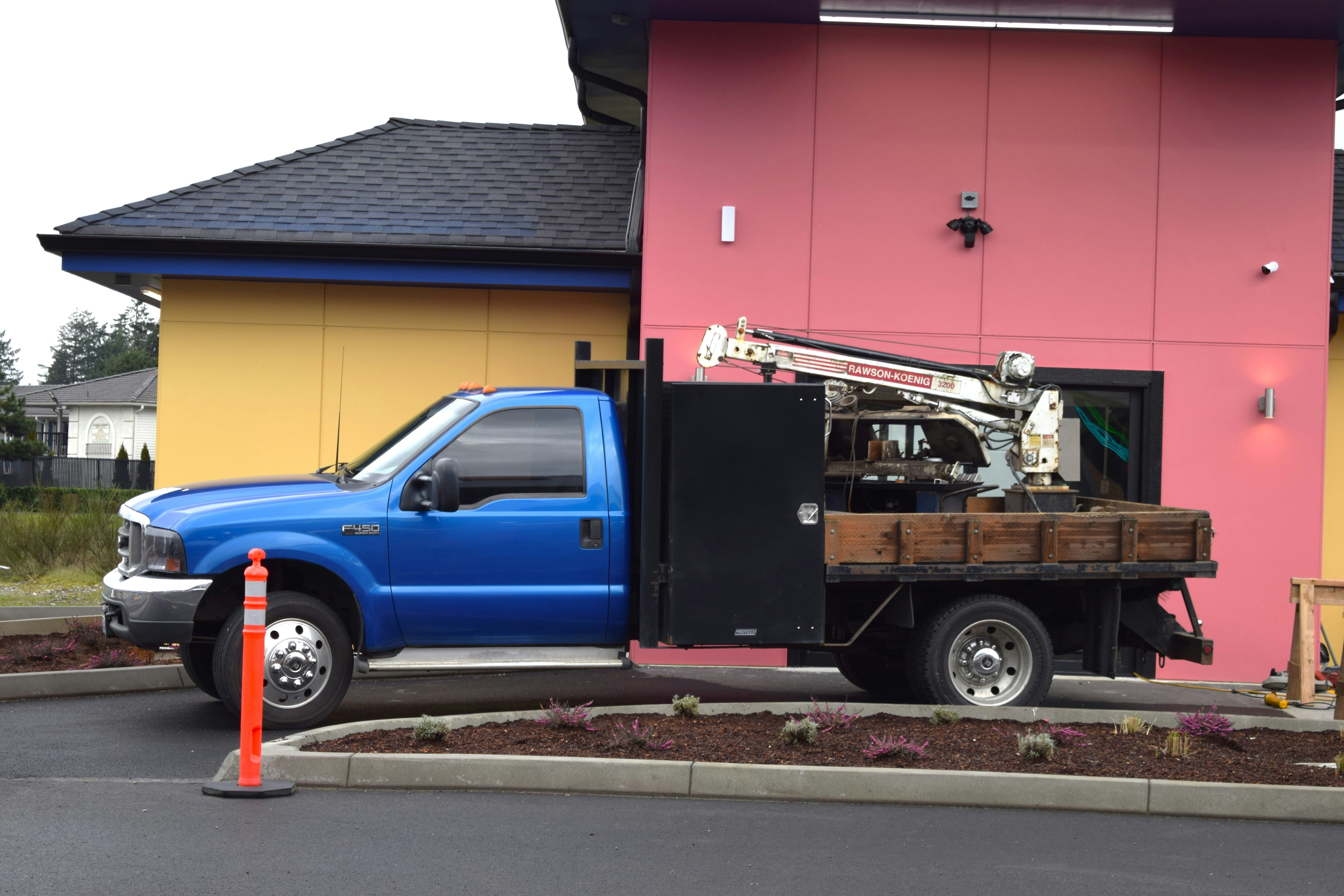 Upfitted service truck with crane arm