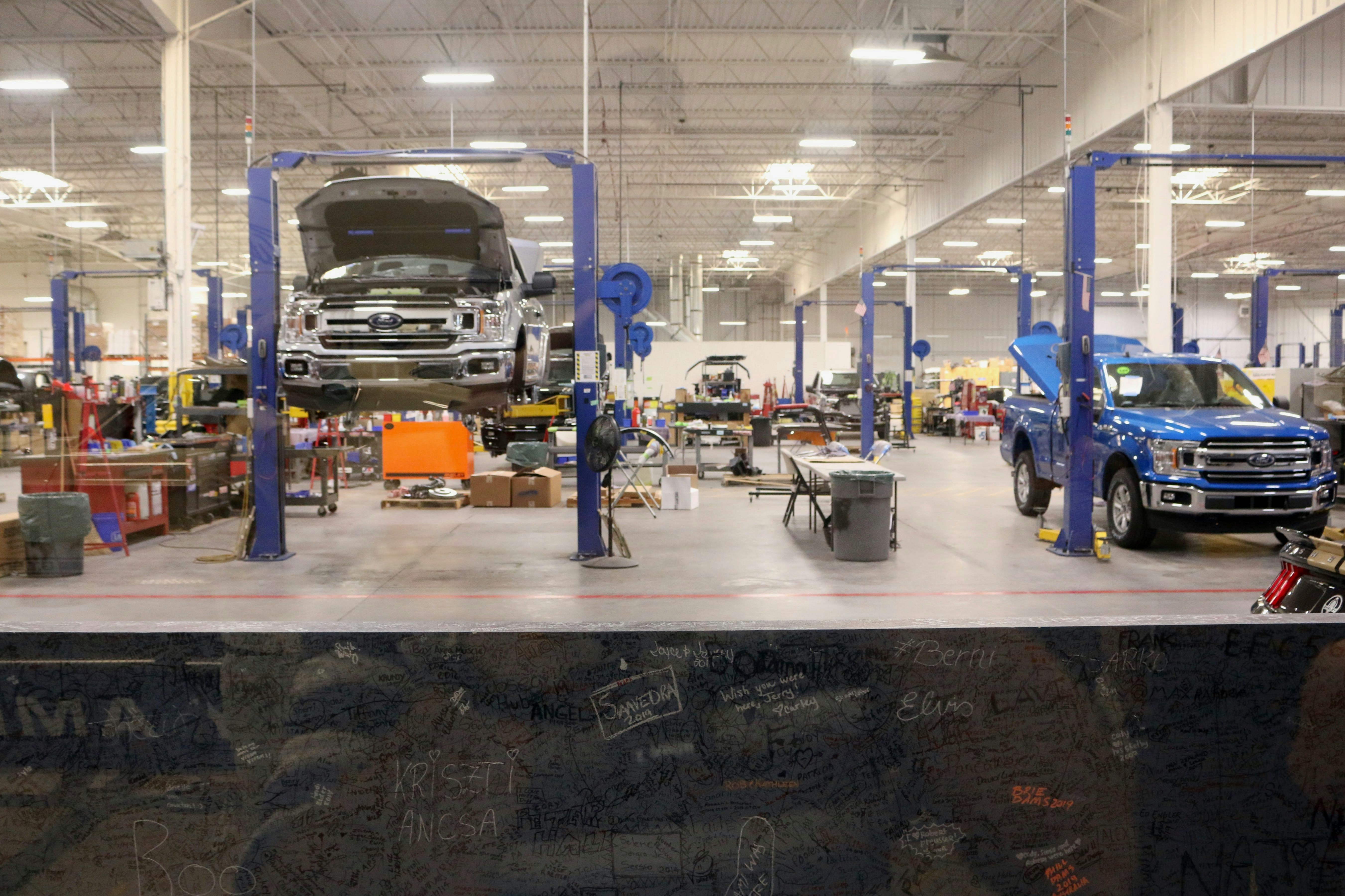 Truck service bays with vehicles on lifts